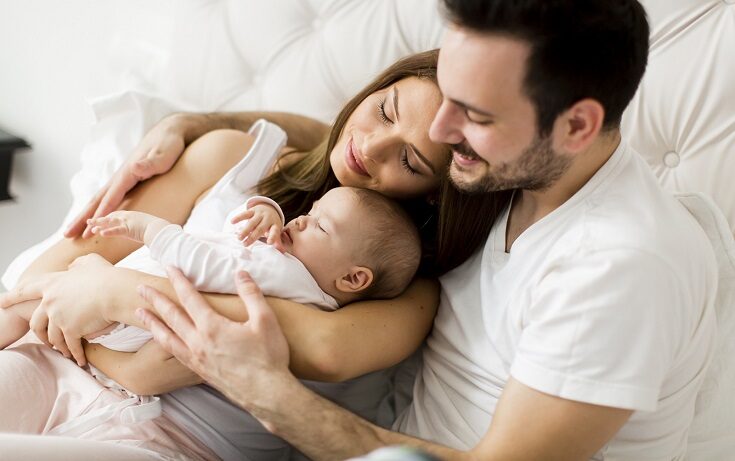 Happy family with newborn baby